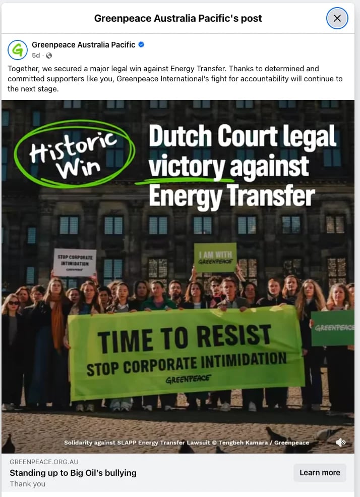 Greenpeace activists holding green banner reading Time to Resist Stop Corporate Intimidation outside court building celebrating Dutch legal victory against Energy Transfer